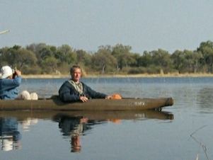 Poling a mokoro along a Delta channel
