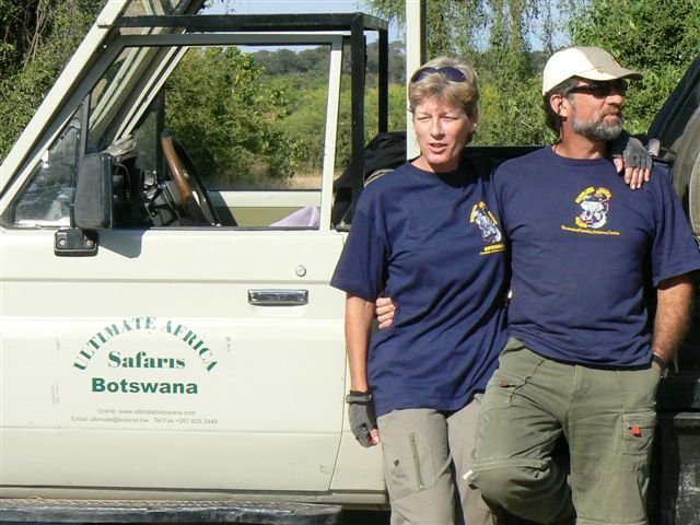 Toff and Kiddy Hill beside their safari vehicle